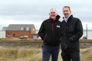 David Newell, chair of the Teesmouth Seal Conservation Trust, with PD Ports chief executive officer Frans Calje in front of the new seal hospital site